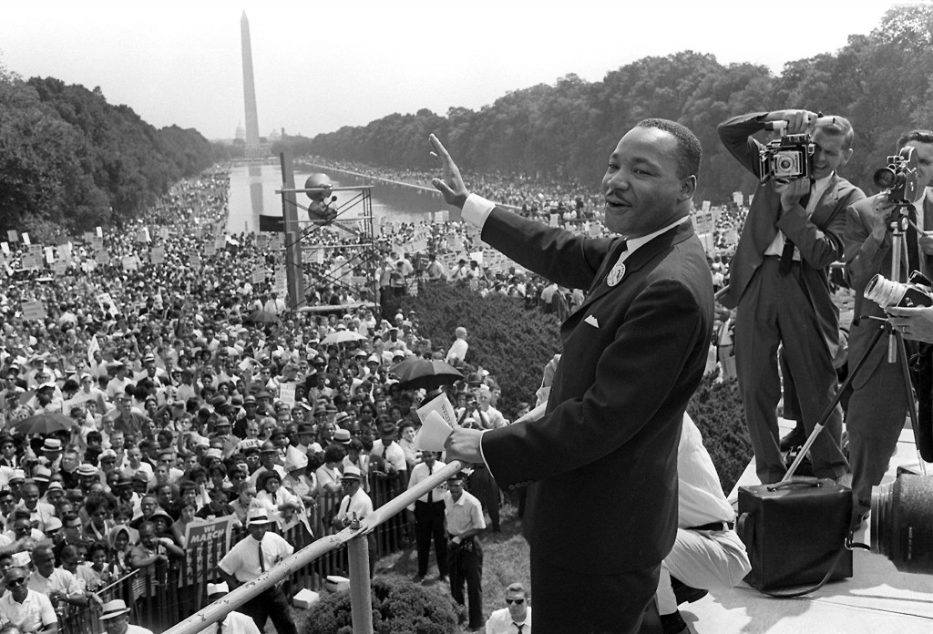 Martin Luther King waving to the crowd before his I have a dream speech on the Capitol Mall with the Washington Monument in the background